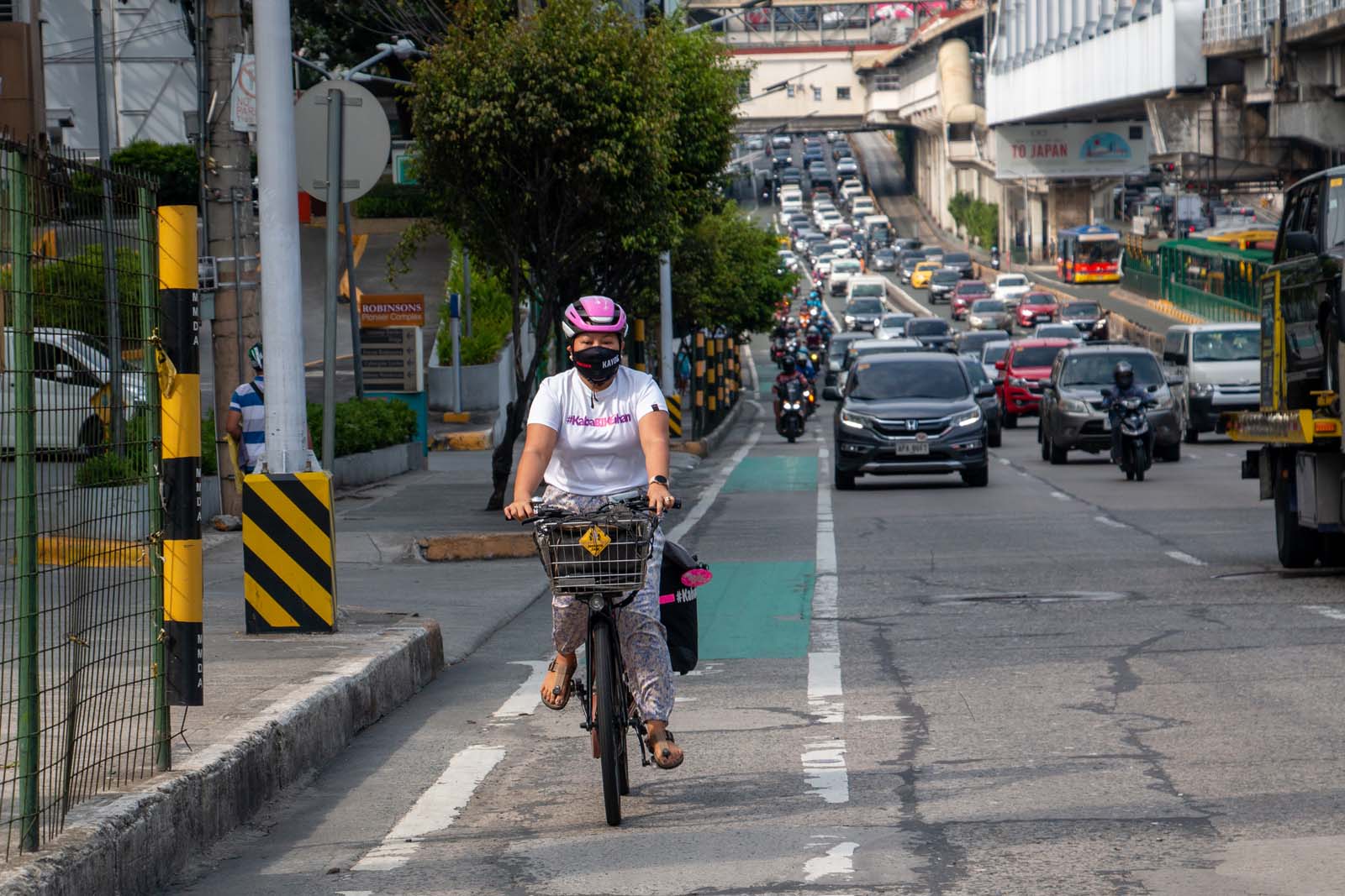 When using her bicycle as her primary mode of transport, Jaramia Amarnani, 41, braves unfriendly drivers and near-absent bike lanes in Metro Manila, Philippines. Photo by Jhesset O. Enano
