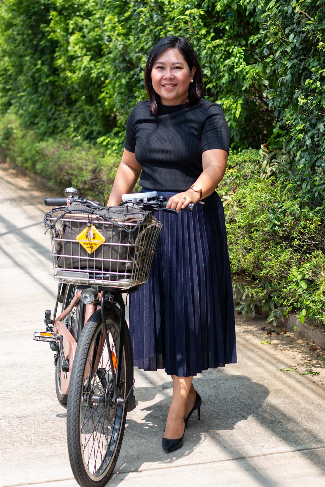 After biking six kilometers from her home to her office, Jaramia Amarnani changes into her office clothes and stiletto shoes. Her co-workers are often surprised when they learn that she bikes to work every day. Photo by Jhesset O. Enano